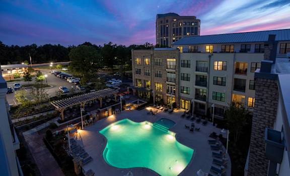 nighttime view of property pool at Berkshire Ninth Street, Durham, NC