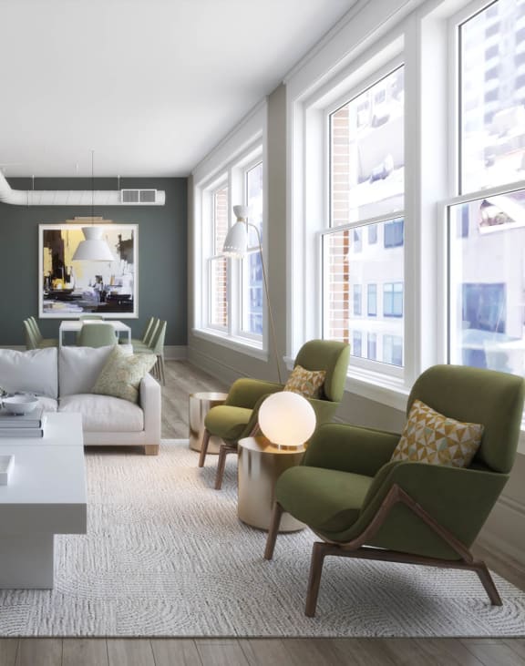 a living room with a white couch and a table at East 4th Street, Cleveland