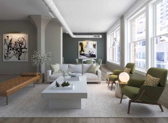 a living room with a white couch and a table at East 4th Street, Ohio, 44115