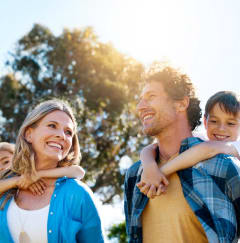Family Walking Together Outside Smiling