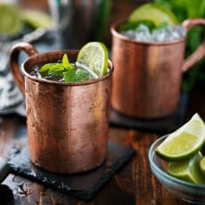 a mule drink in a copper mug with a slice of lime