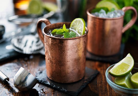 a mule drink in a copper mug with a slice of lime