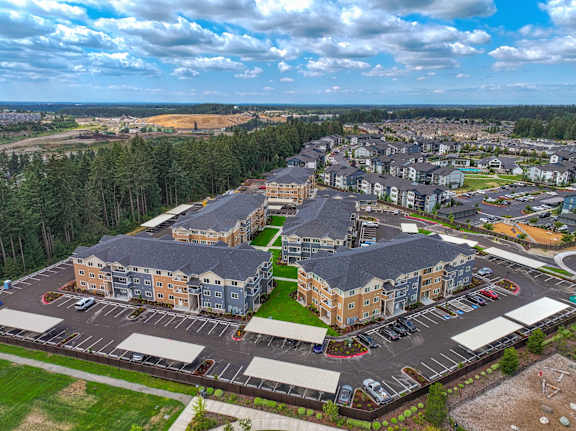 A large apartment complex with multiple buildings and parking lots.