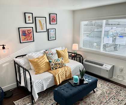 a bedroom with a bed and a window