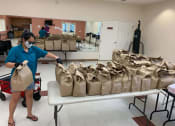 Thumbnail 4 of 13 - grocery bags being organized in the Lemon Hill community room