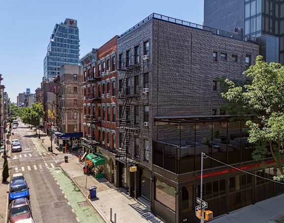 A cityscape with a mix of modern and older buildings.