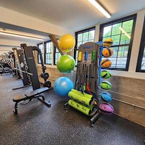 Gym with exercise balls and training equipment at The Overlook Apartments, Weymouth, MA