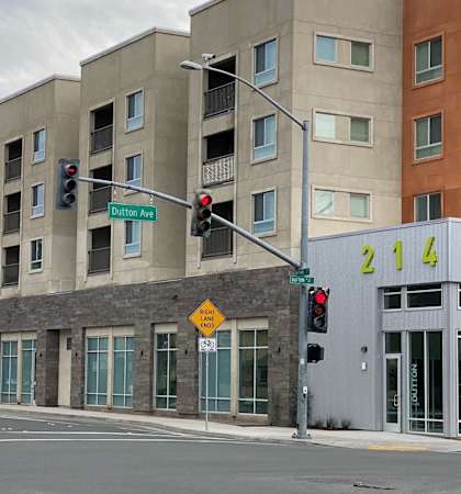 A street view of a building with a sign that says 214.