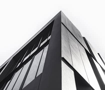 a black and white photo of the side of a building