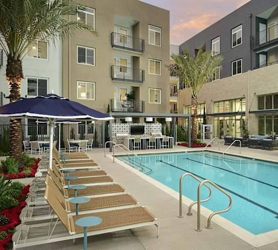 a swimming pool in the middle of an apartment building