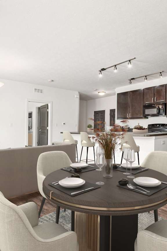 A modern dining room with a table set for four. at River View at Bexley Apartments, River View at Bexley, Ohio