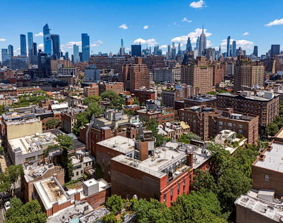 A cityscape with a mix of residential and commercial buildings.