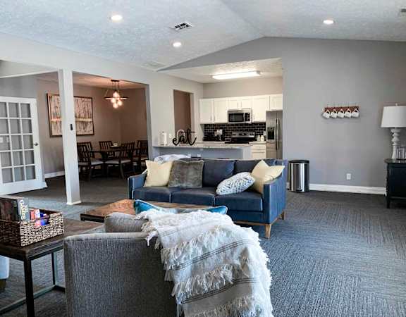 apartment clubhouse with a couch and a table