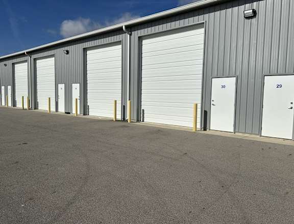 A long row of storage units with numbers 30 and 29 visible.
