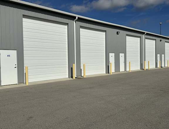 A row of garage doors are closed.