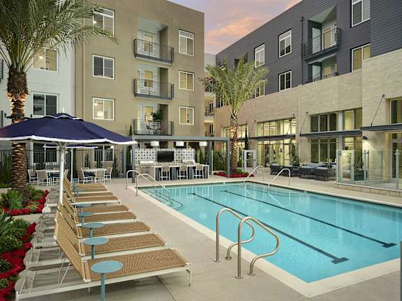 a swimming pool in the middle of an apartment building