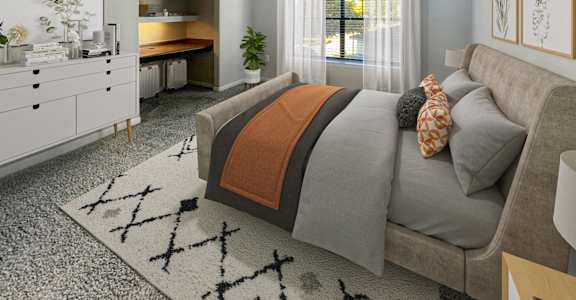 a bedroom with a bed and a ceiling fan