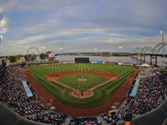 A baseball game is being played in a stadium with a large crowd watching. at Deer Valley Apartments, Silvis, Illinois