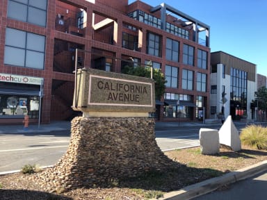 a sign that says california avenue in front of a brick building