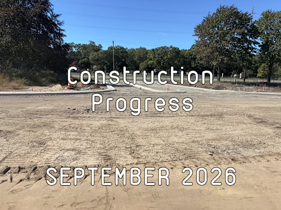 A construction site with the text "Construction Progress SEPTEMBER 2026" overlaid on it.