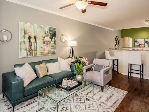 pacious apartment living room with modern furnishings, natural light, and an open, welcoming layout.
