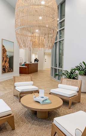 a living room and dining room with a couch and a table