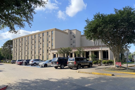 a large building with a parking lot in front of it