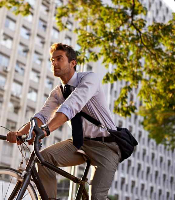 Man Wearing Dress Clothes and Riding Bicycle