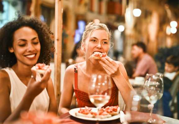 Women Eating Pizza at University Village Apartments, Colorado Springs, Colorado 80918