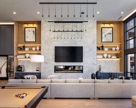 Aura 3Twenty Apartments in McKinney, Texas Clubhouse Lounge with Fireplace and Billiards Table