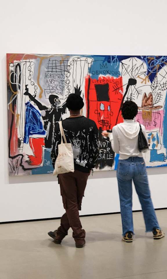 Man and Woman Standing Next to Each Other Admiring Art
