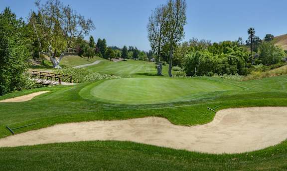 a view of the 18th green on the golf course golf club