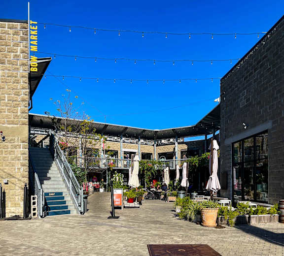 A sunny day at the Bow Market with a clear blue sky.