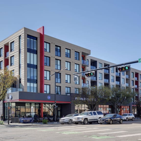 a rendering of a building on the corner of a city street at Southpark on Whyte, Edmonton, Alberta, T6E 3S3