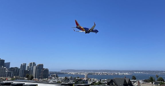an airplane flying over the city