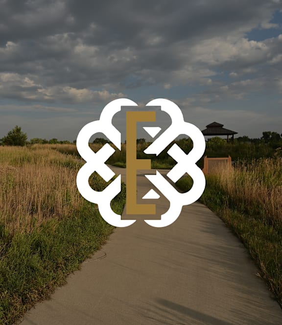 The Edison at Wheat Ridge Apartments in Wheat Ridge, Colorado Logo over Image of Walking Path