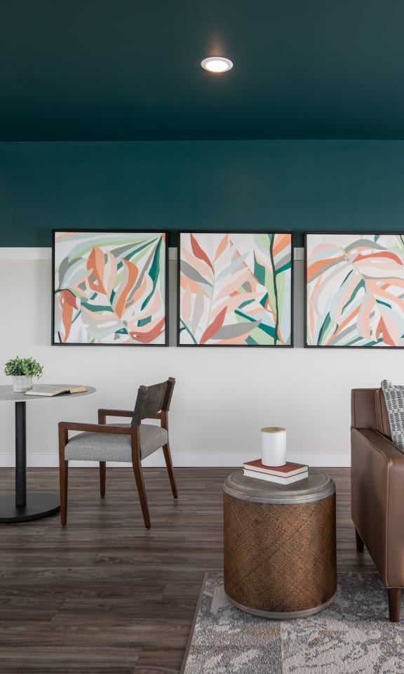 a living room with a couch and chairs and a table