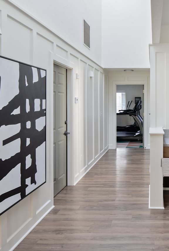 Aspire Columbia Ridge Apartments in Portland, Oregon Clubhouse Hallway and View into Fitness Center