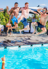 Male Residents Jumping in Pool at Abberly CenterPointe Apartment Homes, Midlothian, 23114