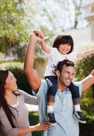 Happy Family Walking Outdoors at Abberly Avera Apartment Homes, Manassas, VA