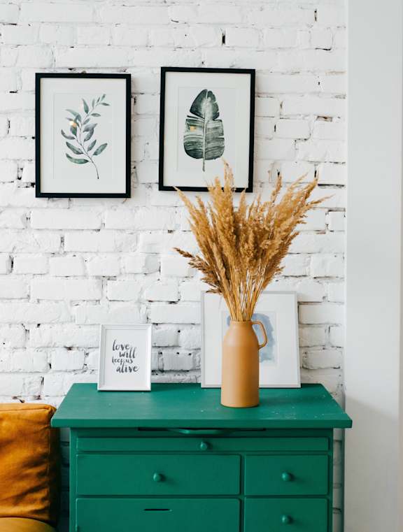 Stock image of dresser and wall decor
