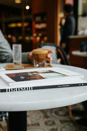 Close Up View of Books on Table in Coffee Shop