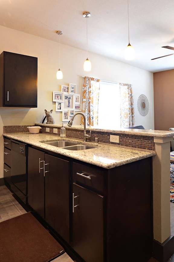 Stainless Steel Sink With Faucet In Kitchen at H Squared Apartments, Denton