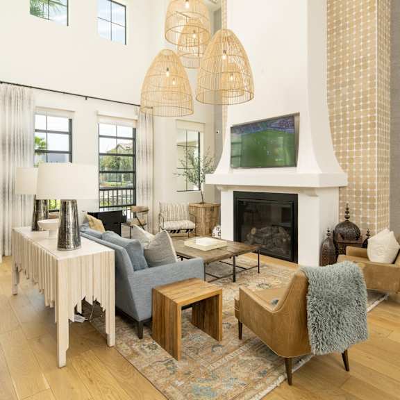 A modern outdoor living space with a fire pit and comfortable seating.