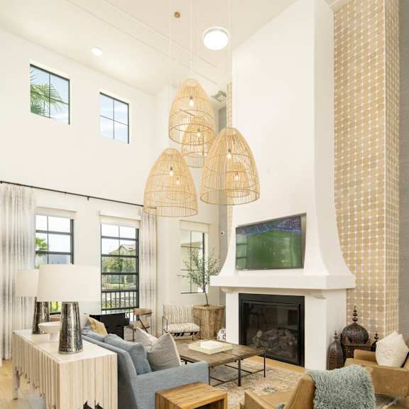 A modern outdoor living space with a fire pit and comfortable seating.