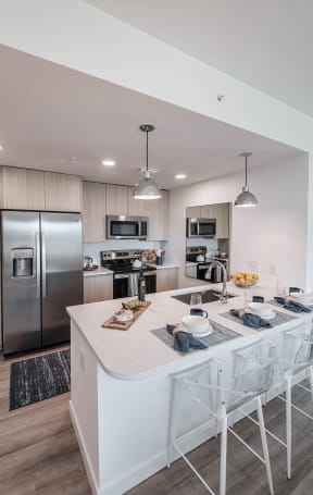 a rendering of a living room with a dining room and kitchen at Altis Santa Barbara, Florida, 34104
