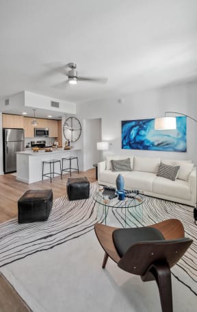 a rendering of a living room with a dining room and kitchen at Altis Blue Lake, Lake Worth, 33467