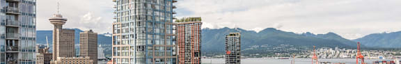 the city with the mountains in the background