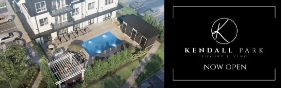 an aerial view of a swimming pool in front of a house