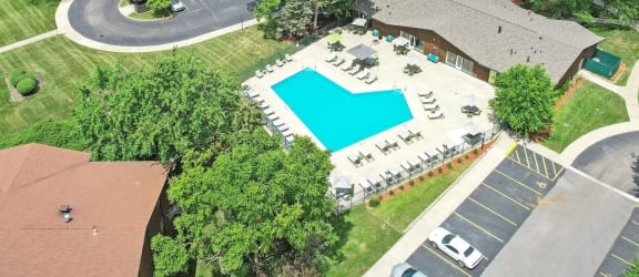 an aerial view of a pool in the backyard of a house at Hampton in Highland Apartments, Highland